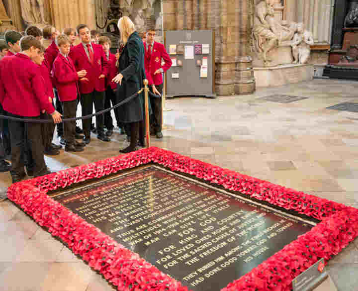 A group of secondary school students view the Grave of the Unknown Warrior
