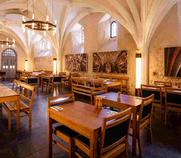 Empty tables and chairs in the Cellarium restaurant