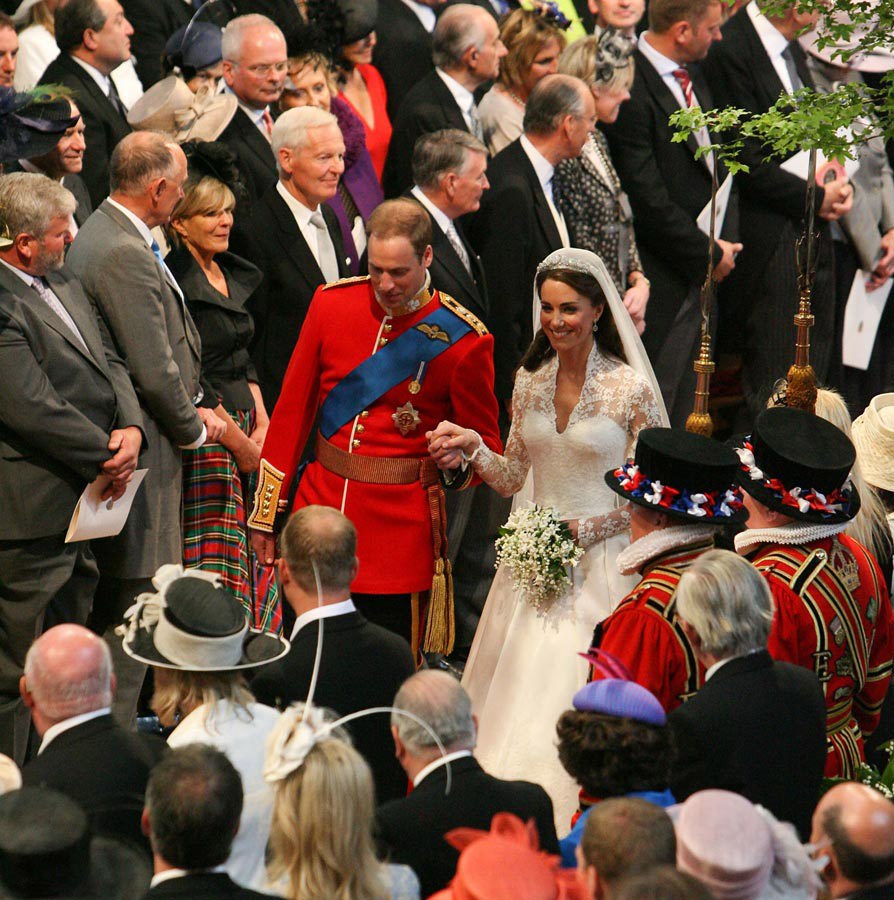 Prince William of Wales and Catherine Middleton walk down the aisle of Westminster Abbey on their wedding day