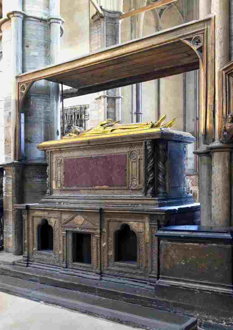Side view of Henry III's tomb with bronze effigy on top and purple porphyry and gilding on the sides