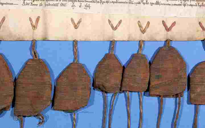 Seal bags attached to a manuscript in the collection of the Westminster Abbey Library