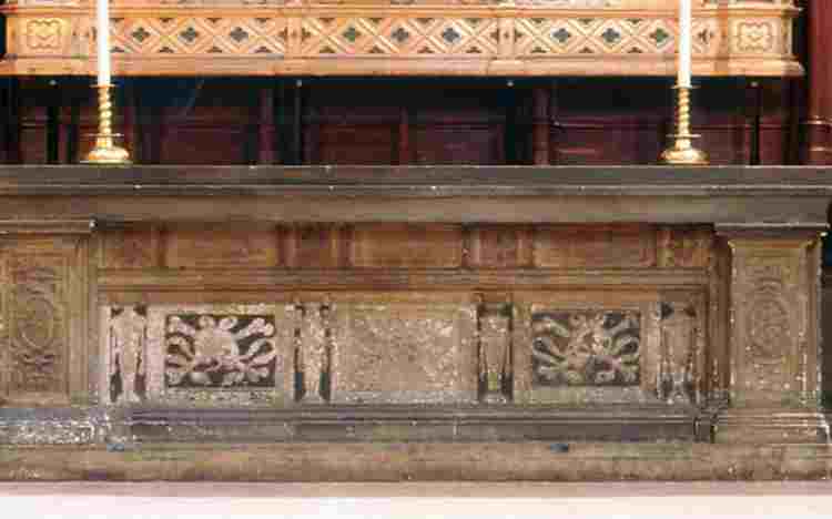 Stone tomb of Anne of Cleves with carvings of lions' heads and skulls and crossed bones