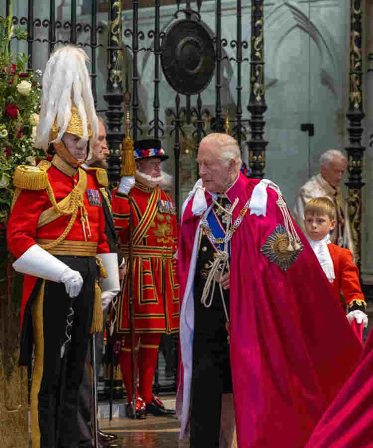King Charles III wears the red robe of Sovereign of the Order of the Bath