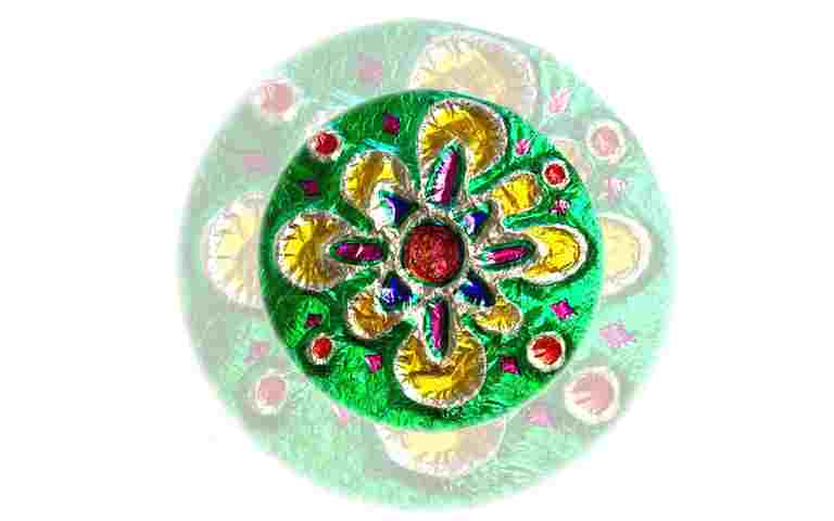 Photograph of colourful shiny circular commonwealth craft