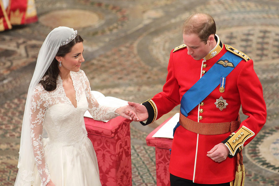 Catherine Middleton and Prince William hold hands after their wedding ceremony