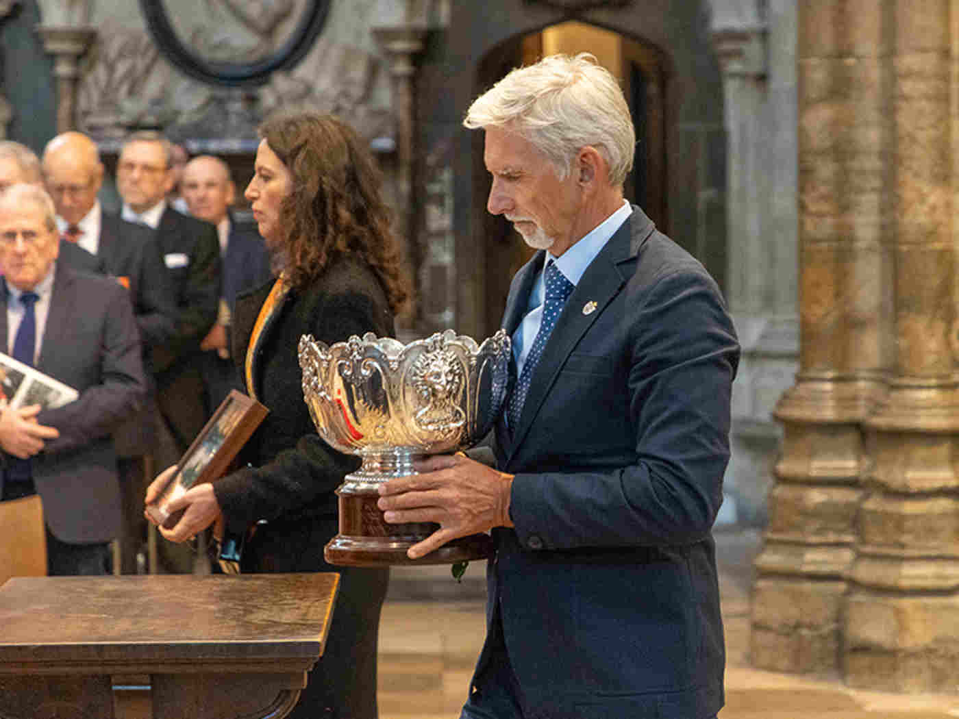 British former racing driver Damon Hill carried Sir Stirling’s Monaco Trophy through the Abbey