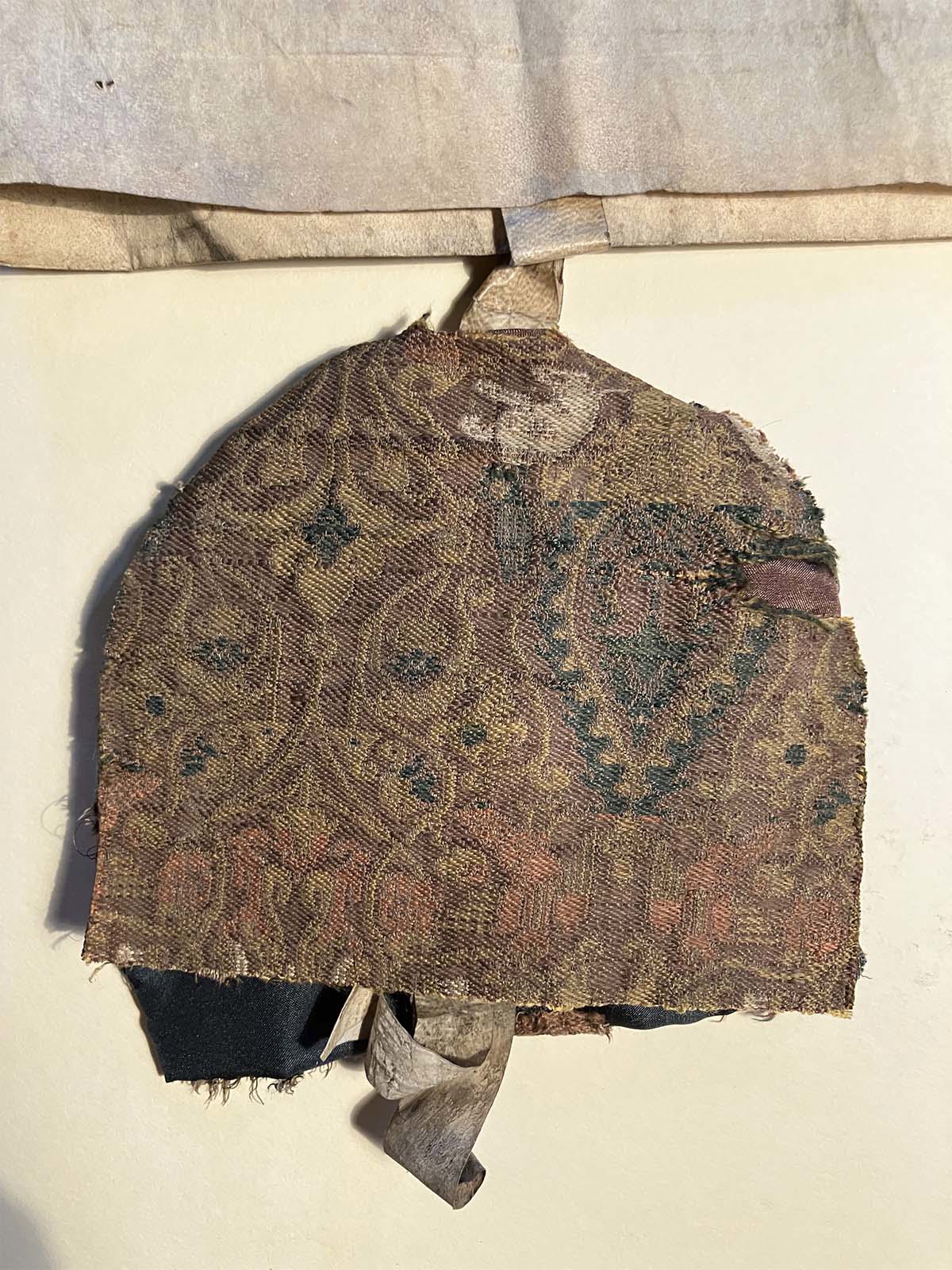 Medieval Silk Bag on display in the Queen's Diamond Jubilee Galleries at Westminster Abbey