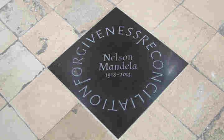 Photograph of a floor memorial to Nelson Mandela within Westminster Abbey, with the words forgiveness and reconciliation circling his name