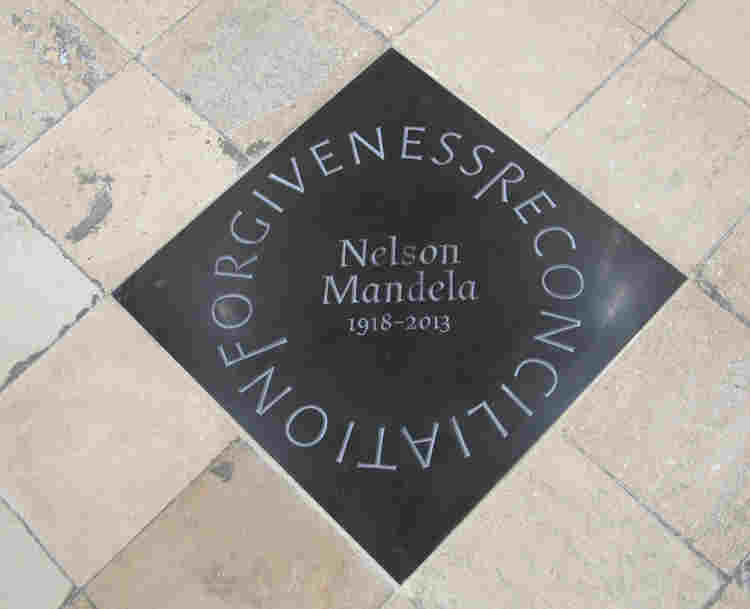 Photograph of a floor memorial to Nelson Mandela within Westminster Abbey, with the words forgiveness and reconciliation circling his name