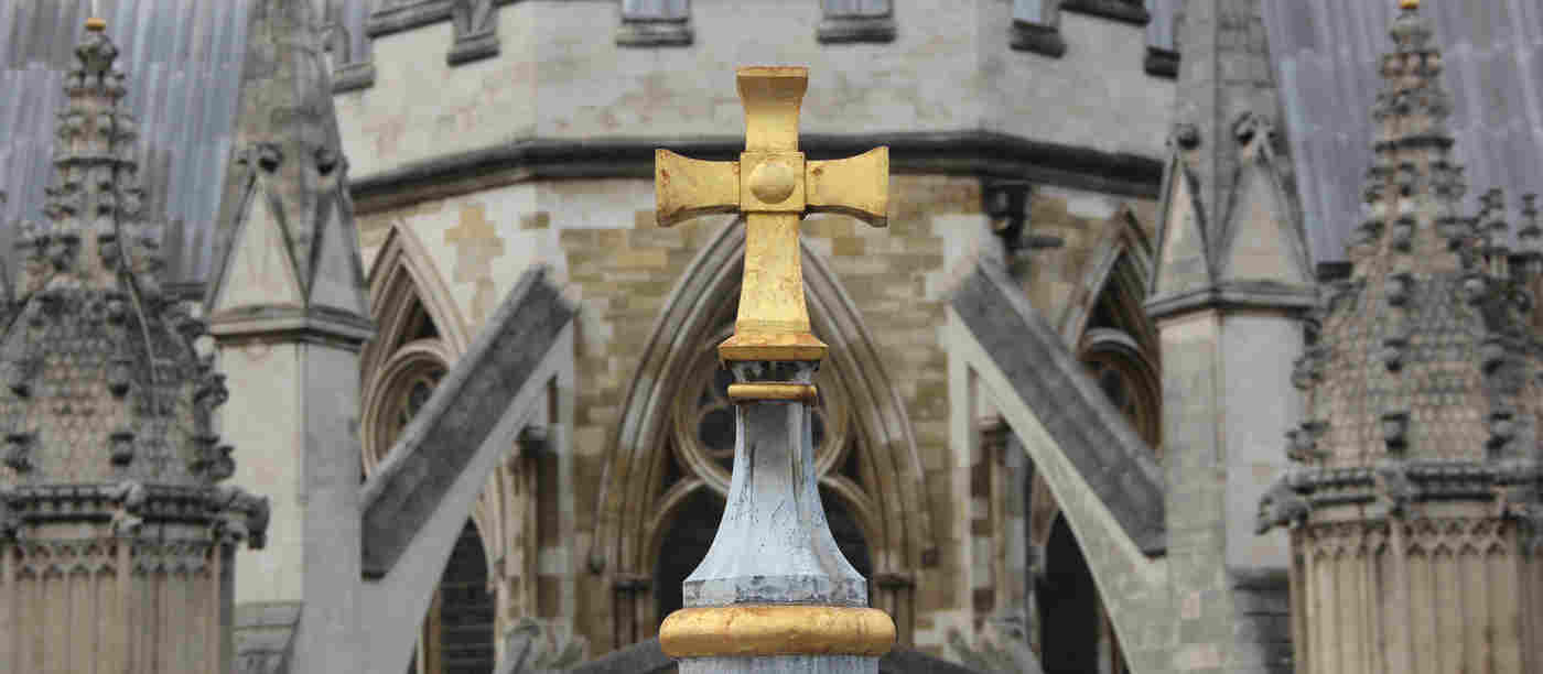 Photograph of gold cross on top of the Lady Chapel roof of Westminster Abbey
