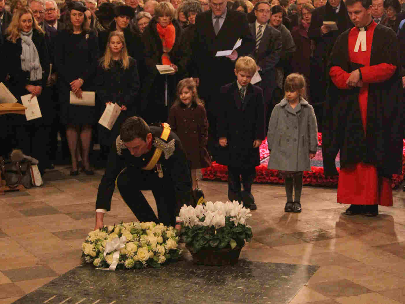 Captain George Trypanis, The Queen's Royal Hussars, lays a wreath
