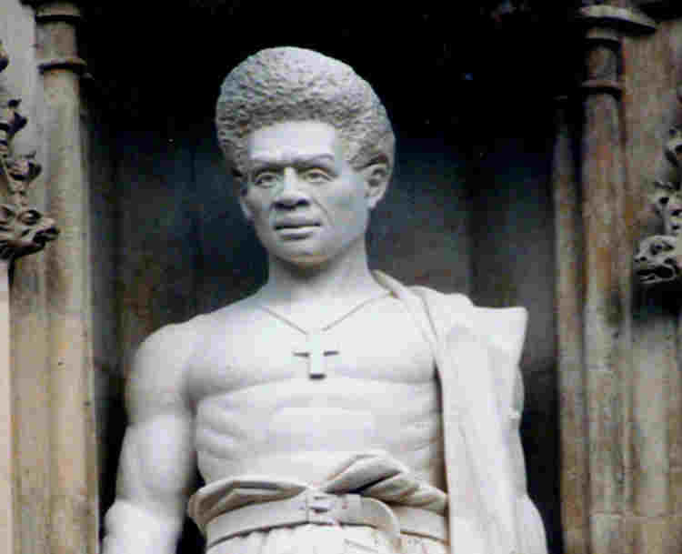 Photograph of Lucian Tapiedi statue, one of 10 modern martyrs above the Great West Door at Westminster Abbey
