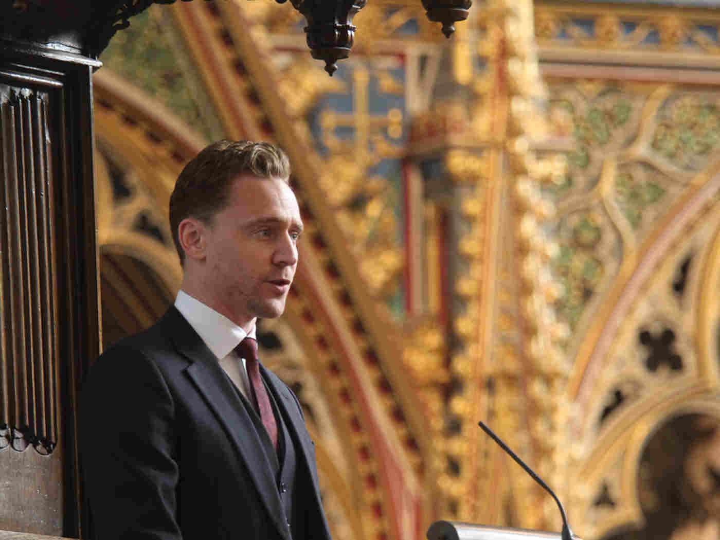 Tom Hiddlestone reads from the Nave Pulpit
