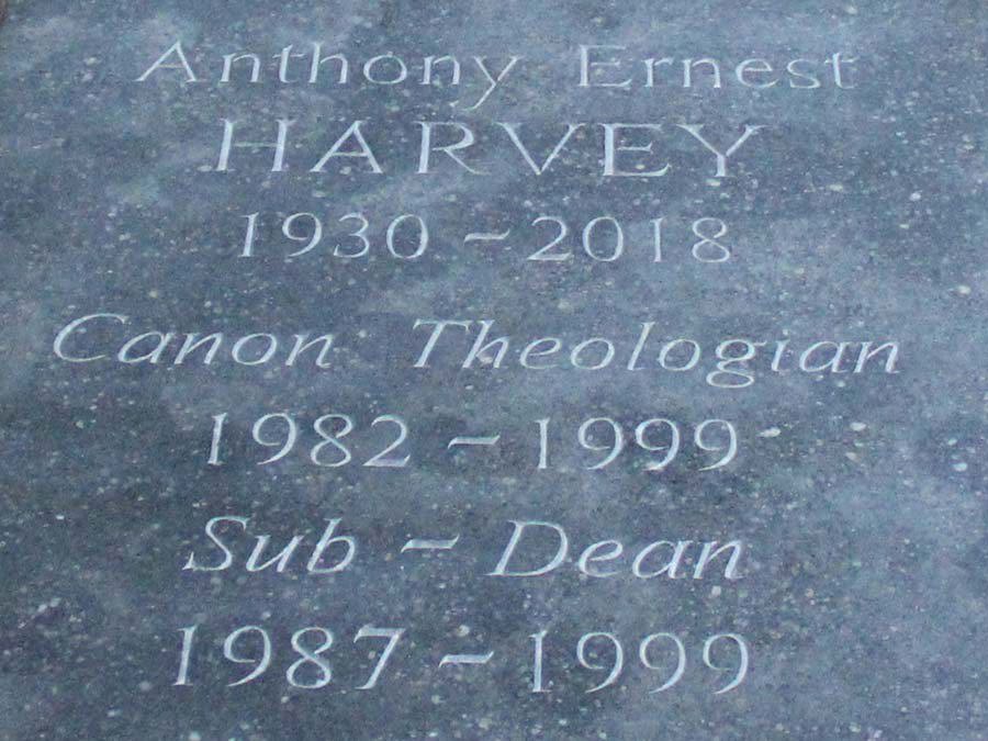 The inscription on the memorial stone to Canon Anthony Harvey in the Great Cloister