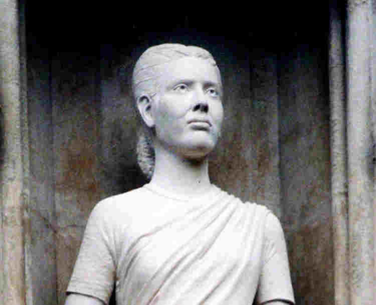 Photograph of Esther John statue, one of 10 modern martyrs above the Great West Door at Westminster Abbey