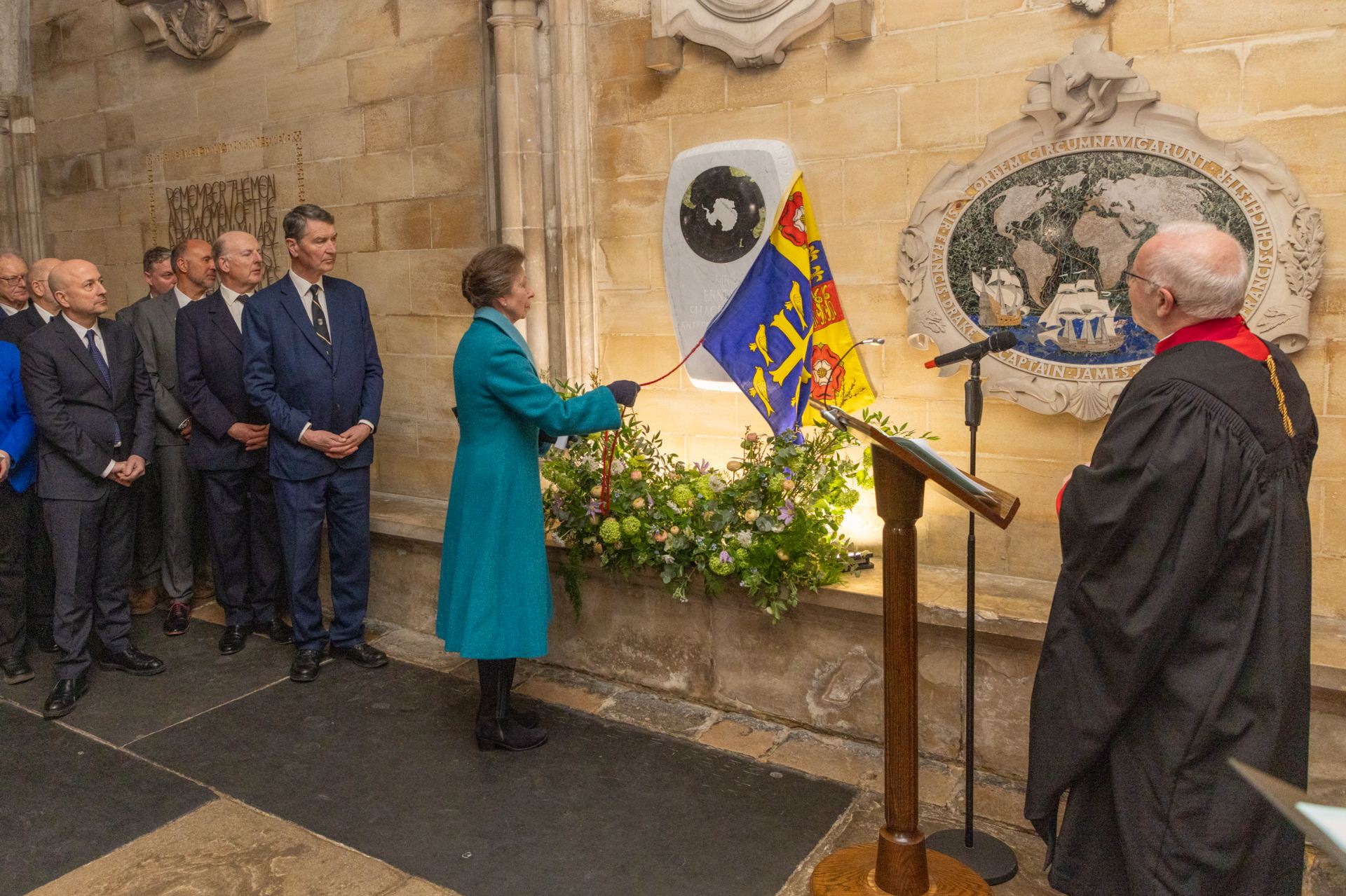 The Princess Royal reveals a memorial to Ernest Shackleton as the Dean of Westminster watches