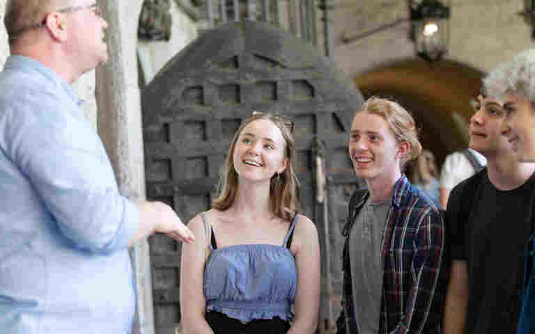 Photograph of teenagers on a tour of Westminster Abbey