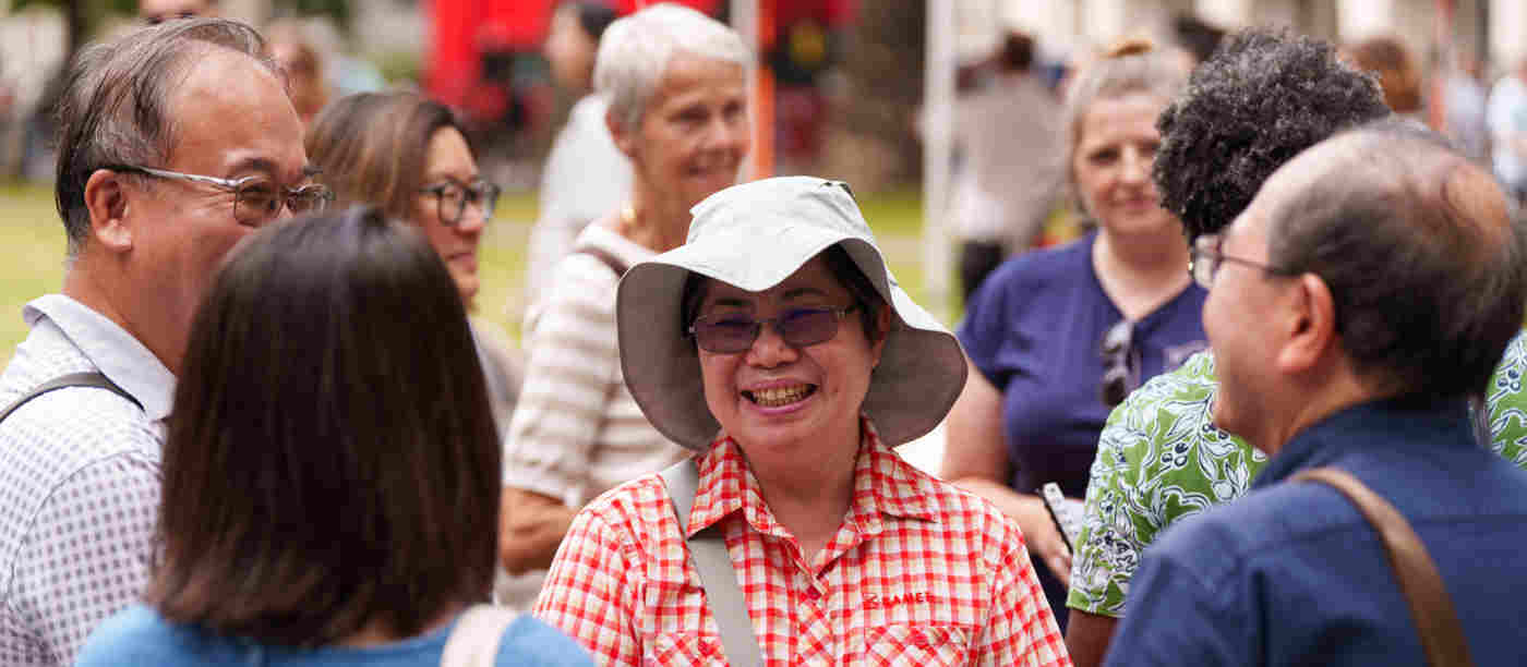 Photograph of visitors in a group smiling