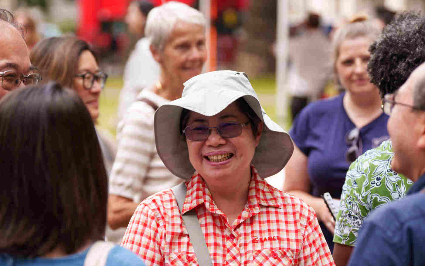 Photograph of visitors in a group smiling