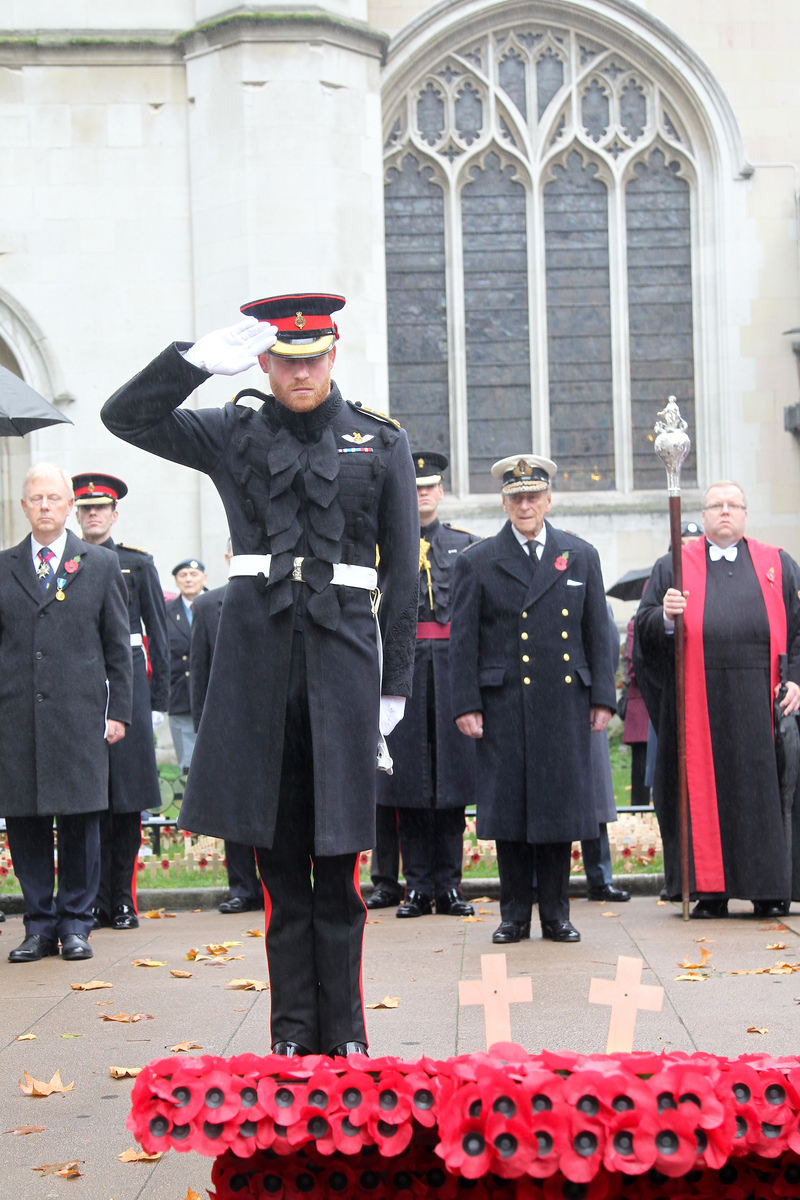 The Duke of Edinburgh and Prince Harry laid crosses of remembrance in front of two wooden crosses from the Grave of Unknown British Soldiers from the First and Second World Wars