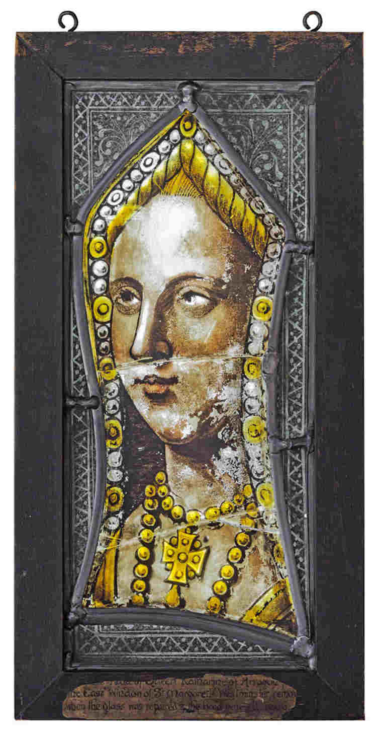 Stained glass depiction of Katherine of Aragon, gold beads and a crucifix around her neck