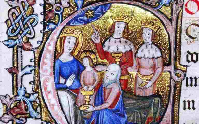 A depiction of the epiphany - a man offers a goblet to a woman and a small child. Two men wearing crowns are stood behind