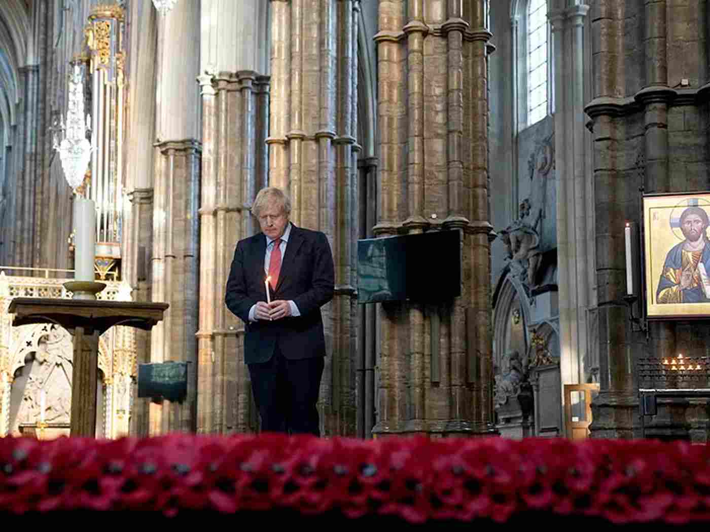 Prime Minister Boris Johnson observes a moment of silence