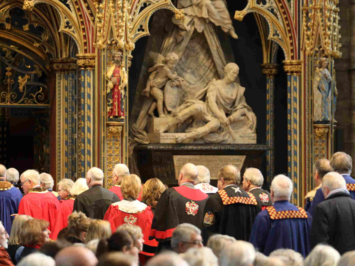 Members of the livery companies of the City of London process through the Abbey church before the service