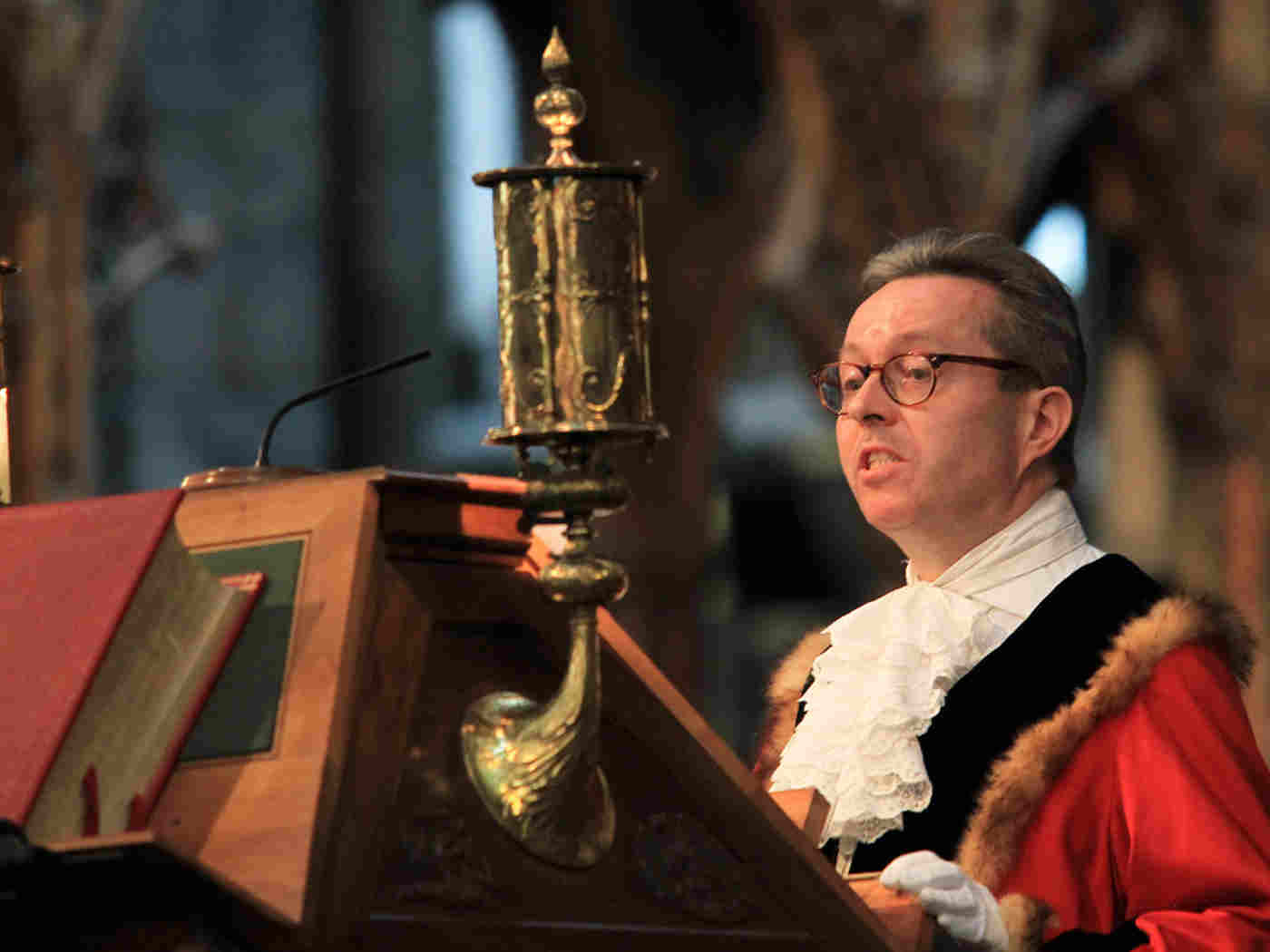 Councillor David Harvey, Deputy Leader, Westminster City Council, reads Deuteronomy 15: 1-11