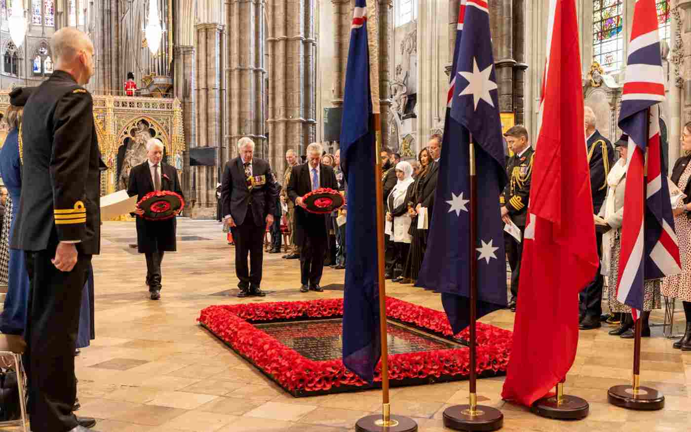 Three men by the Grave of the Unknown Warrior - two of them are about the lay wreaths