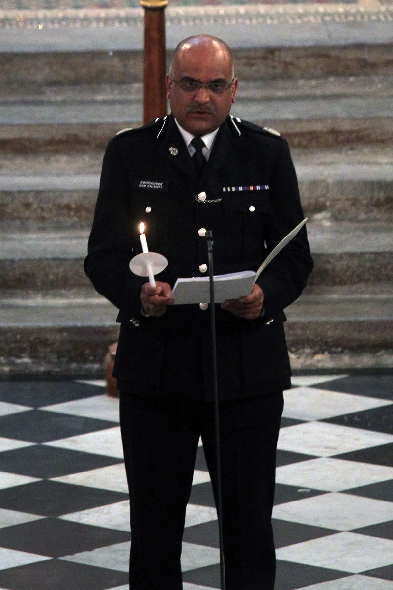 Prayers are said by the Commander Mark Christy, Metropolitan Police Service