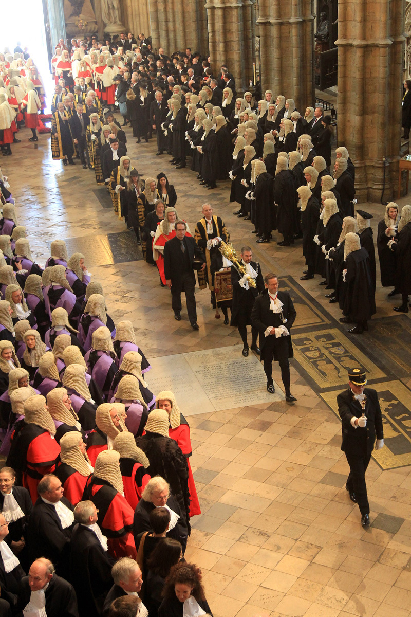 The Tipstaff leads the procession through the Abbey Church