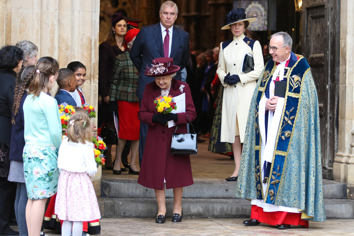 HM The Queen is presented with a posy of flowers after the service