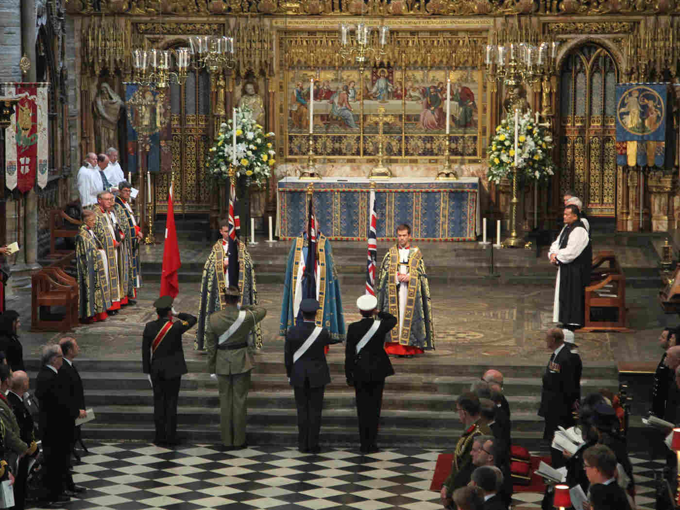 The flags of Turkey, New Zealand, Australia and the UK are returned to their bearers at the end of the service