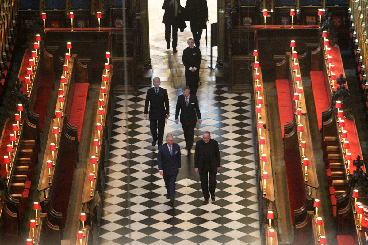 HRH The Prince of Wales walks through the Quire at Westminster Abbey with the Very Reverend Dr John Hall, the Dean of Westminster