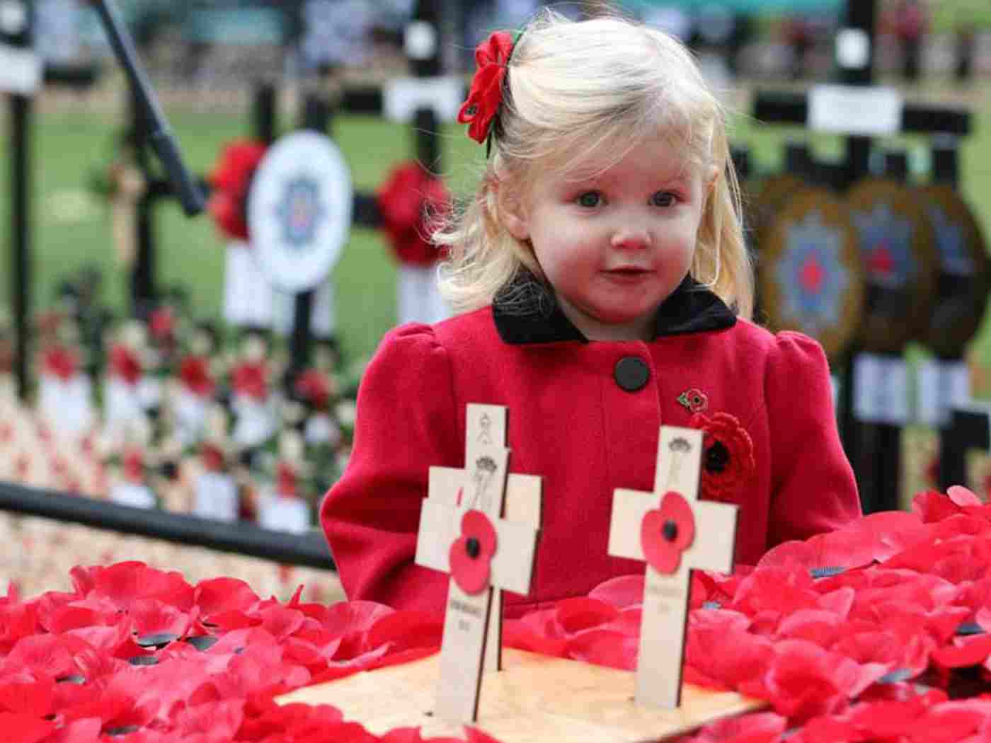 Florence, aged 2, views the crossed laid by the Royal Family