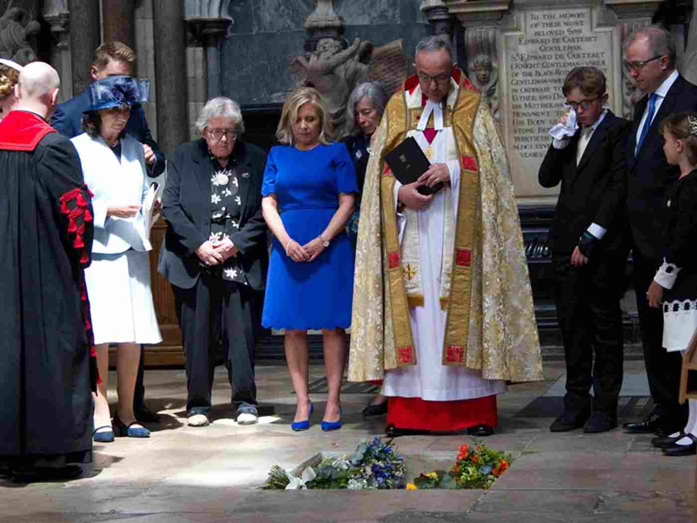 The Hawking family laid flowers and a medal in the grave