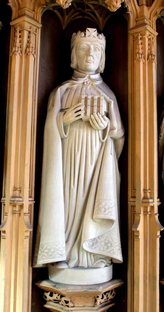 White stone statue of Henry VI wearing a crown, cloak and imperial robes