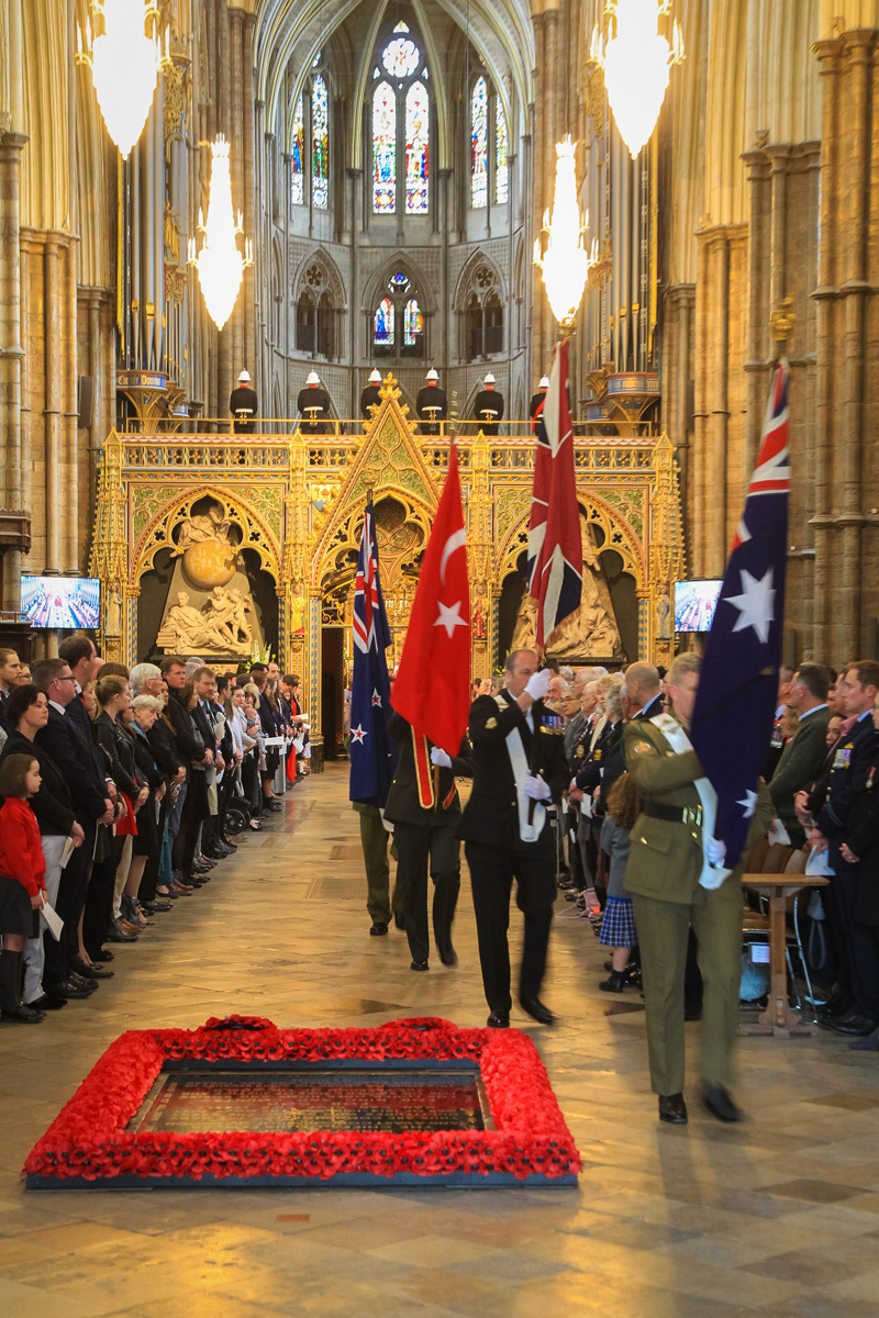 The flags of Australia, the United Kingdon, Turkey and New Zealand are borne through the Abbey Church
