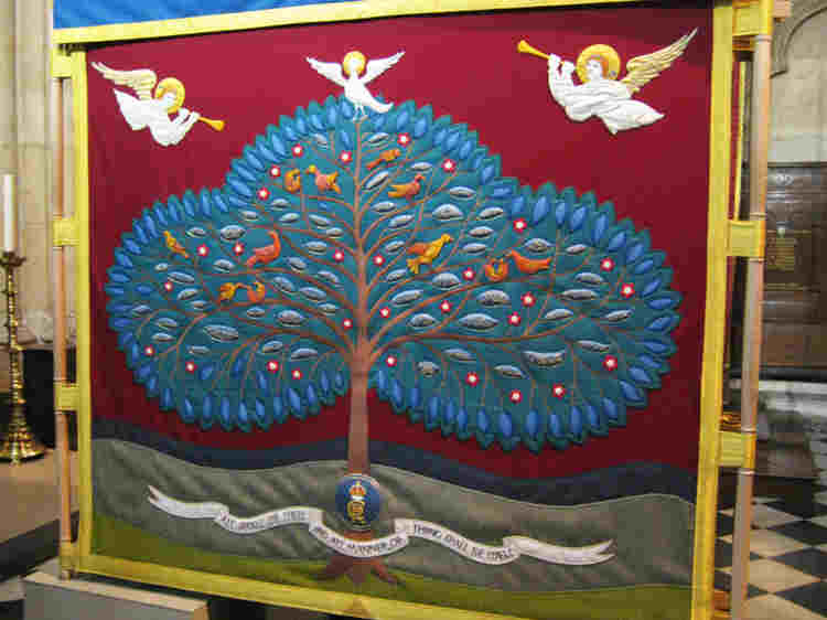 The embroidered Anointing Screen used at the coronation of Charles II showing a tree with leaves naming all the Commonwealth nations, with angels above