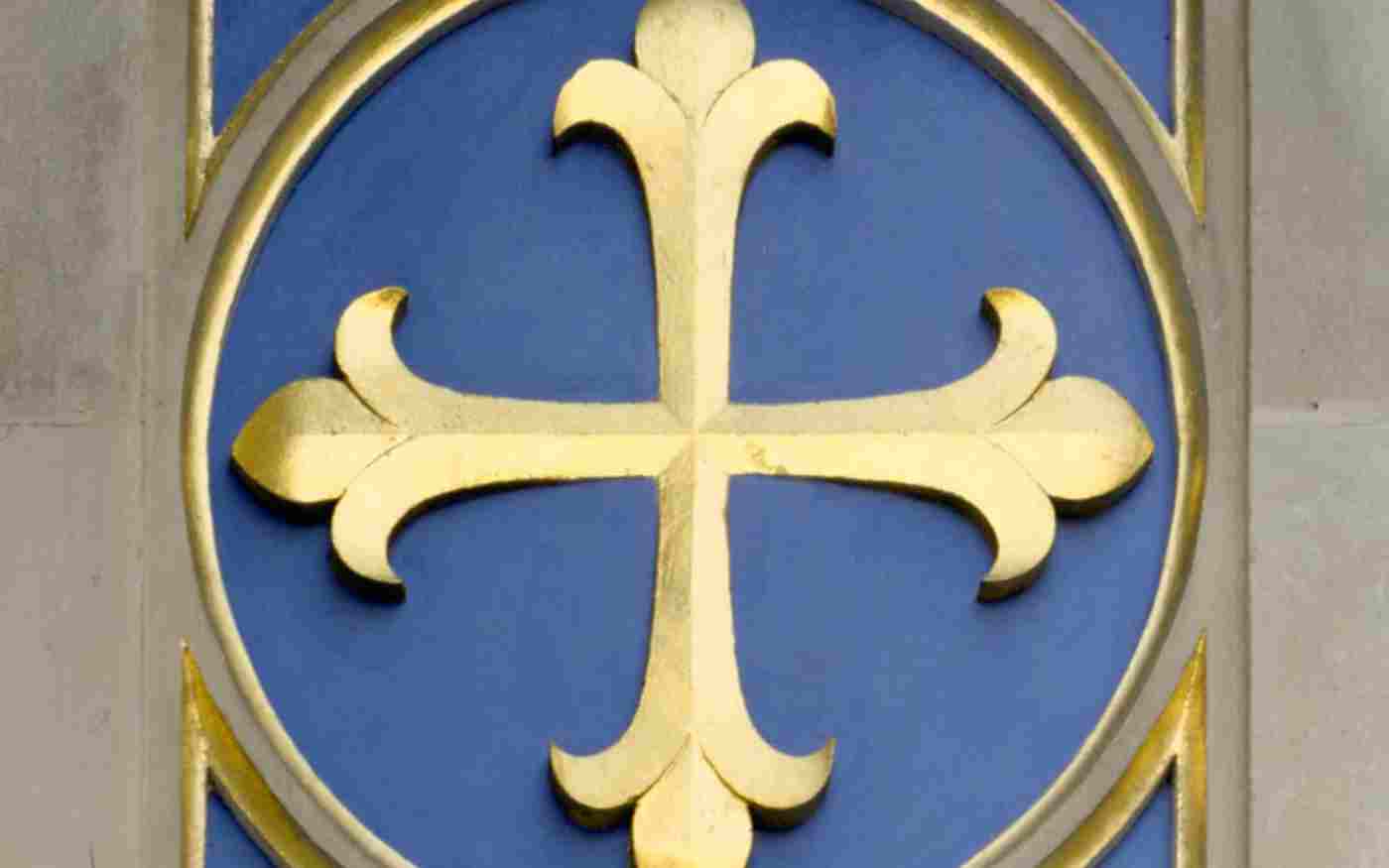Gold cross on a blue background