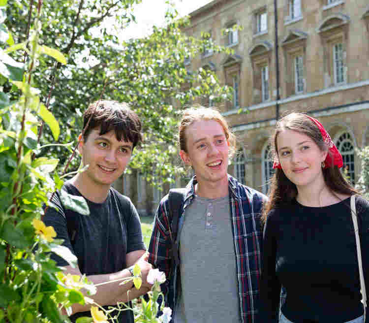 Photograph of a group of young people listening within Westminster Abbey's garden