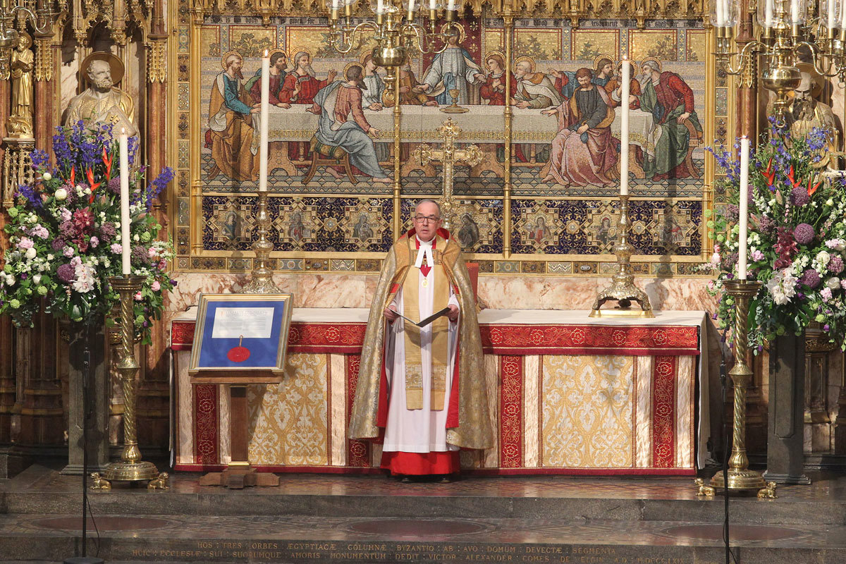 The Dean of Westminster, the Very Reverend Dr John Hall, leads a moment of silence for the victims of the Manchester attack