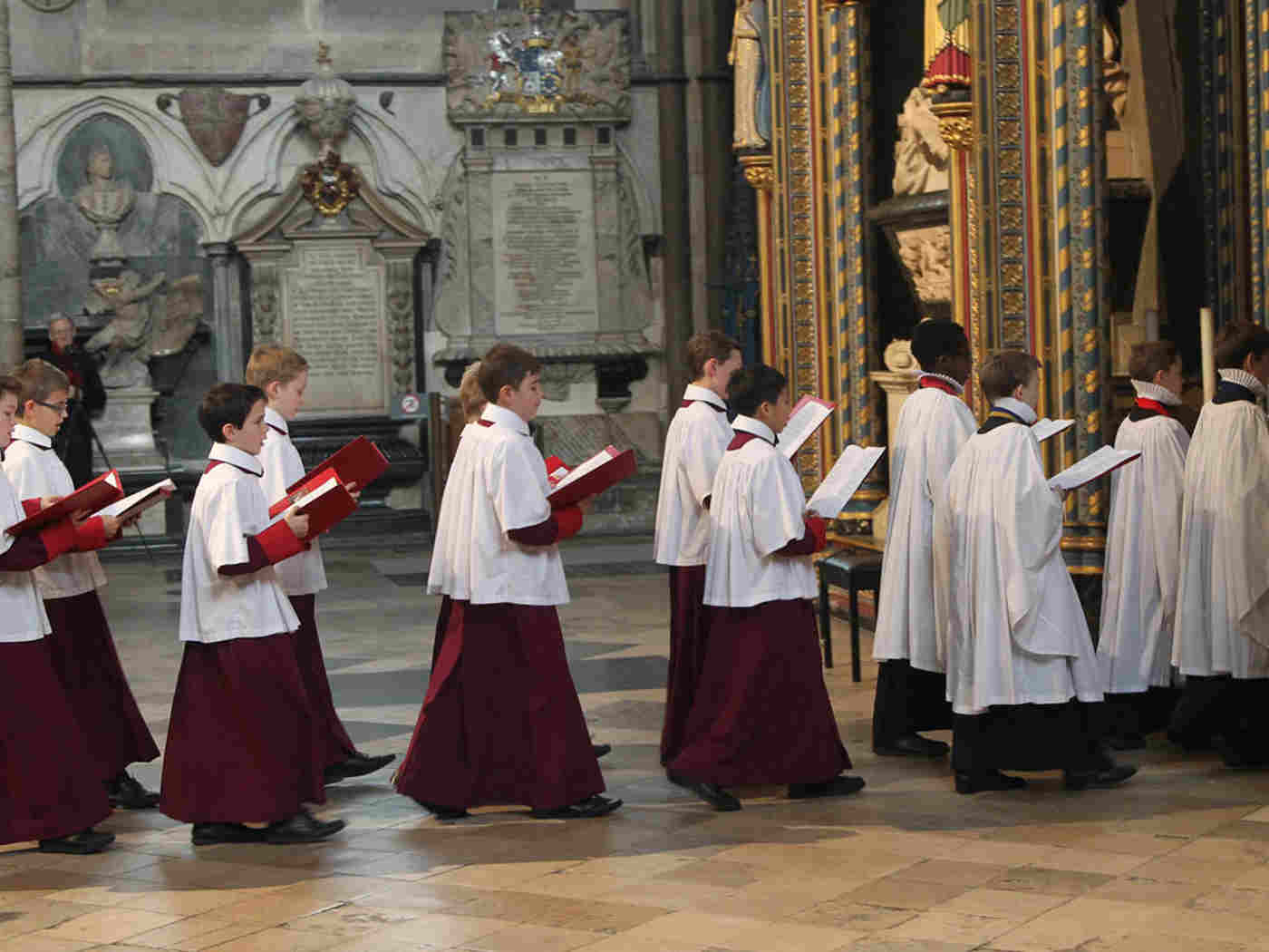 The combined choirs of Westminster Abbey, St Paul’s Cathedral and Westminster Cathedral process through the Abbey
