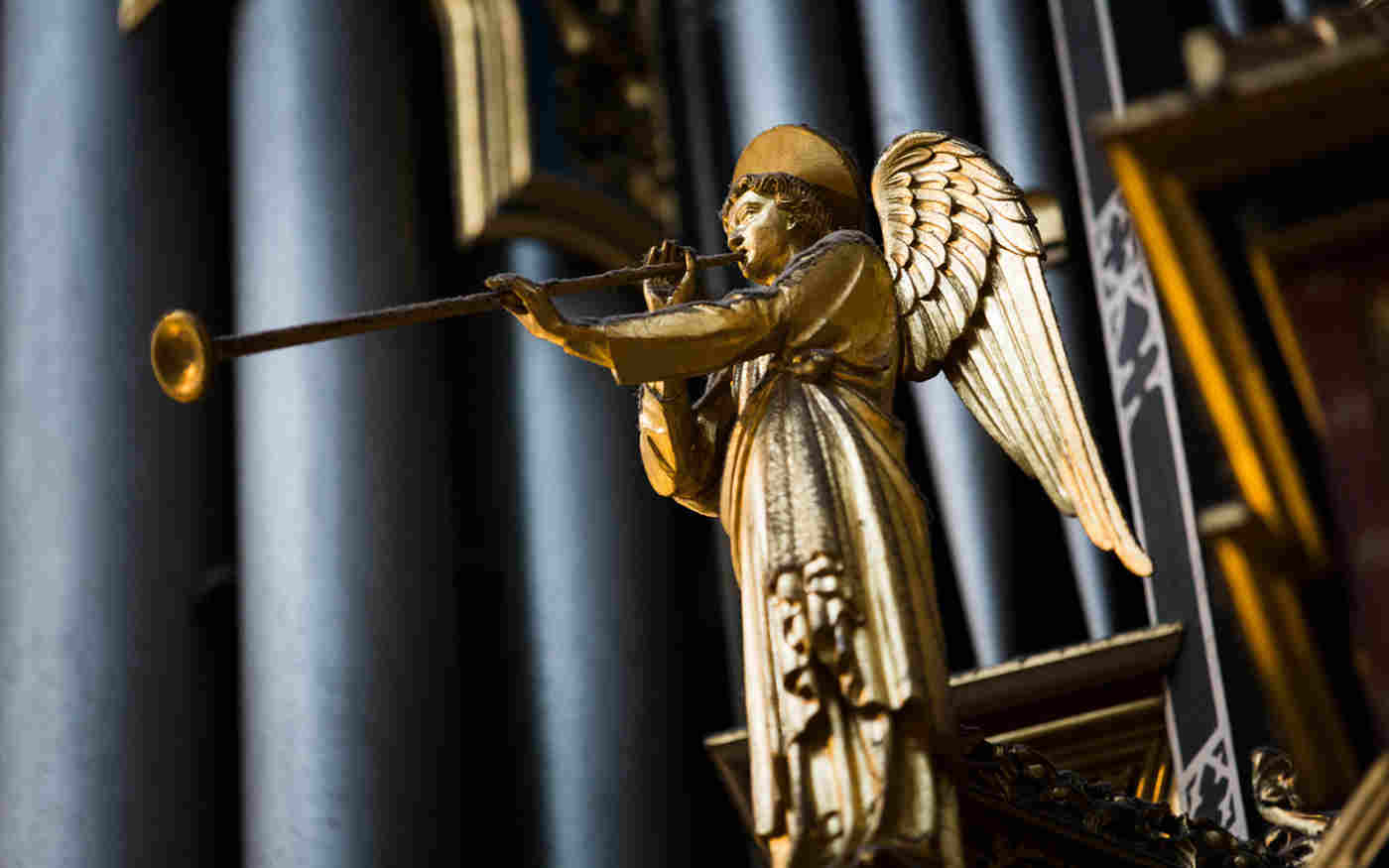Gold statue of an angel blowing a trumpet, decoration on Westminster Abbey's Harrison & Harrison organ
