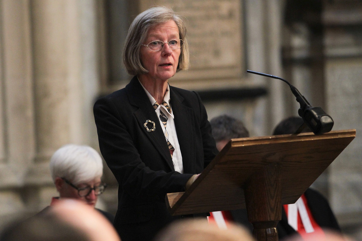 Natalie Carr, widow, reads 1 Corinthians 15: 35-38, 42-44a