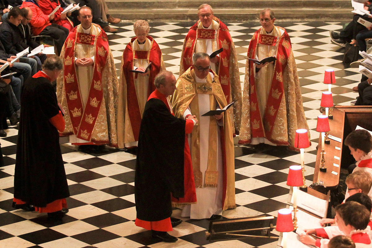The Dean of Westminster, the Very Reverend Dr John Hall, places the High Steward in his stall in the Quire