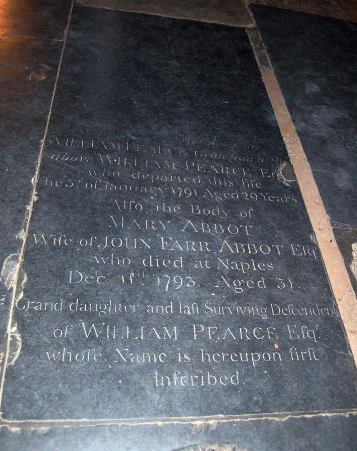 Grey gravestone with the names of members of the Pearce family inscribed on it