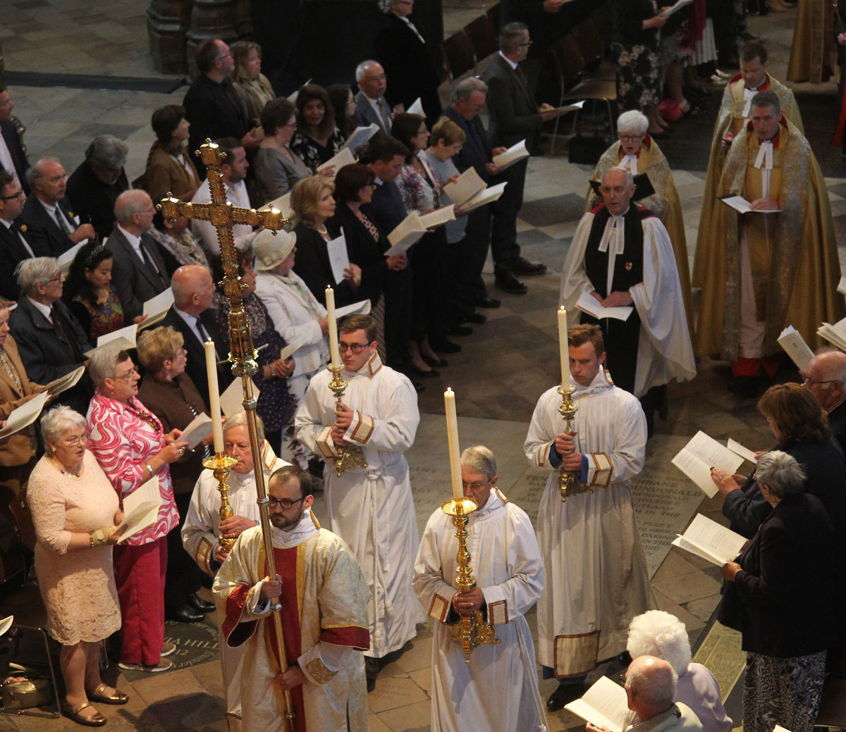 Four candles are processed through the Abbey at the start of the service