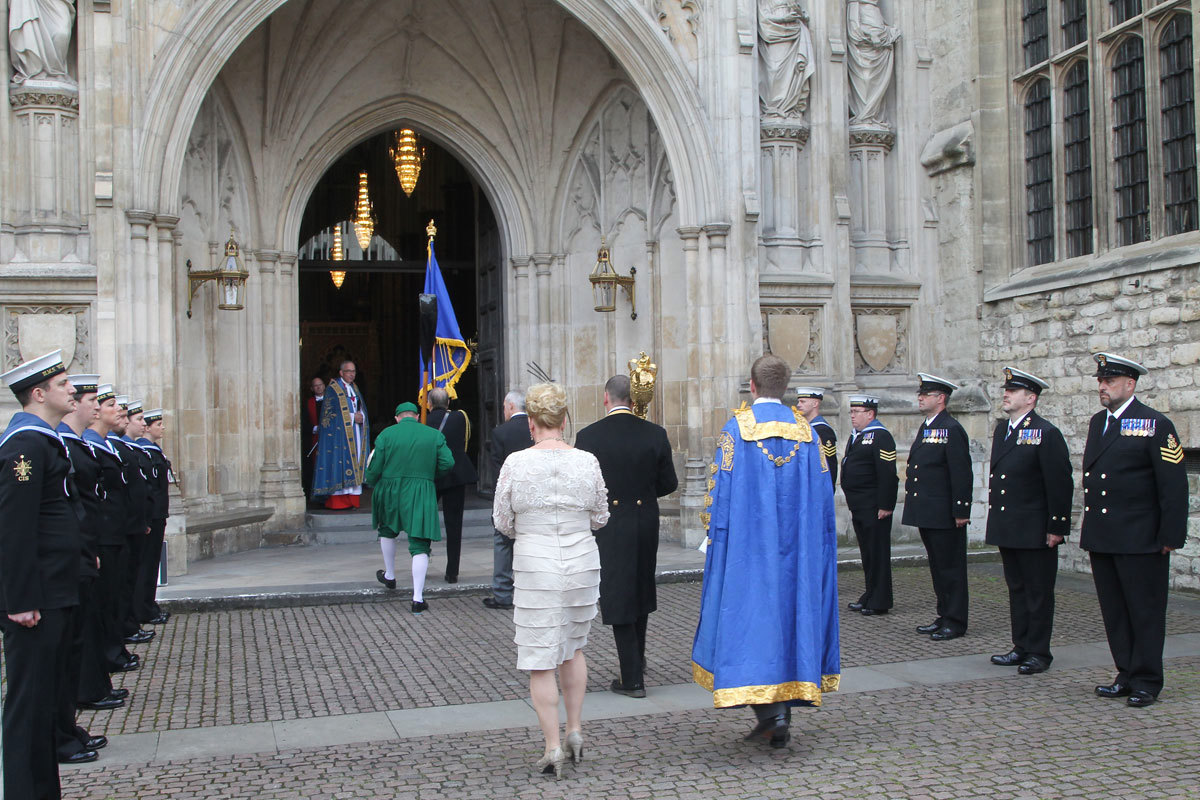 The Dean of Westminster, the Very Reverend Dr John Hall, watches the arrival of the Lord Mayor of Westminster with the Guard of Honour provided by the crew of HMS Westminster